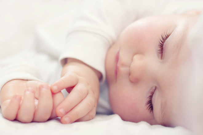 close-up-portrait-of-a-beautiful-sleeping-baby-on-white